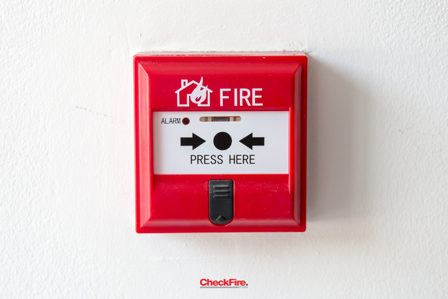 Technician fixing fire alarm system panel